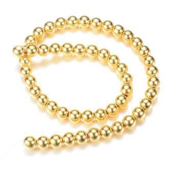 Kaufen Sie Perlen in Deutschland Synthetische goldene runde Hämatitperle 4 mm – Loch: 1 mm (1 Strang – 39 cm)