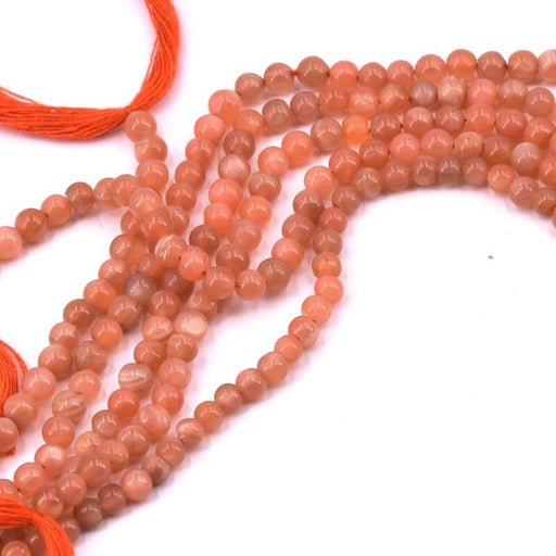 Kaufen Sie Perlen in Deutschland Pfirsichfarbene Mondstein-Perle. rund 3.5 mm – Loch 0.6 mm (1 Strang – 33 cm)