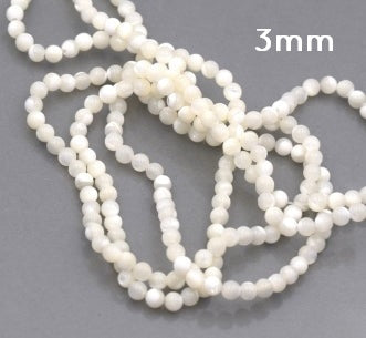 Naturweiße runde Muschelperle 3 mm Loch: 0.6 mm - Strang 39 cm (1 Strang)