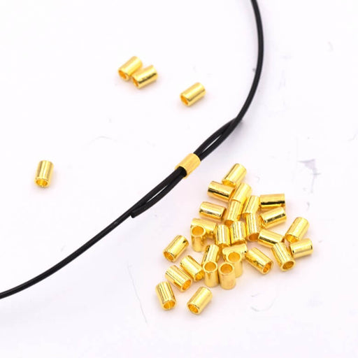 Kaufen Sie Perlen in Deutschland Quetschperlen Gold Metallrohr für elastische Schnur 0.8 mm - 80 Stück (1)
