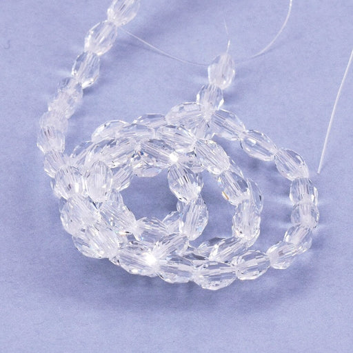 Kaufen Sie Perlen in Deutschland Ovale Glasperle facettiert kristall - 6x4mm - Loch: 0.8mm (1 Strang-40cm)