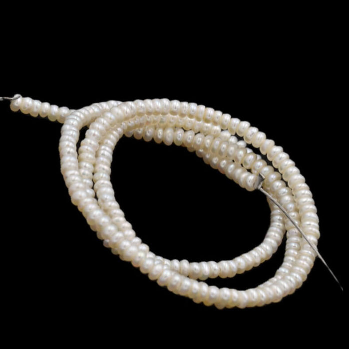 Süßwasserperlen Rondell-Form Farbe: Cremeweiß 3 x 1.5 mm – Loch: 0.5 mm (1 Strang 38 cm)