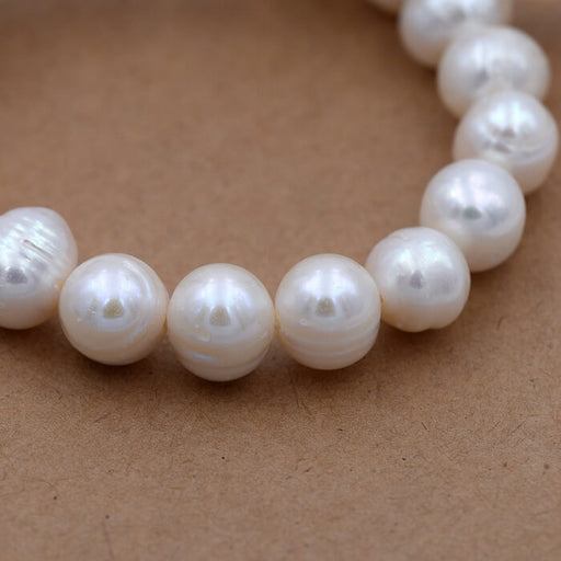 Kaufen Sie Perlen in Deutschland Weiße Popatoe-Süßwasserperle 9–10 mm (1 Strang – 39,5 cm)