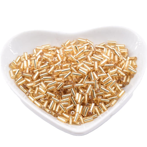 Kaufen Sie Perlen in Deutschland Glasröhrchenperlen hellgold gefüttert - 4–5 x 2 mm – Loch: 0.8 mm (10 g)