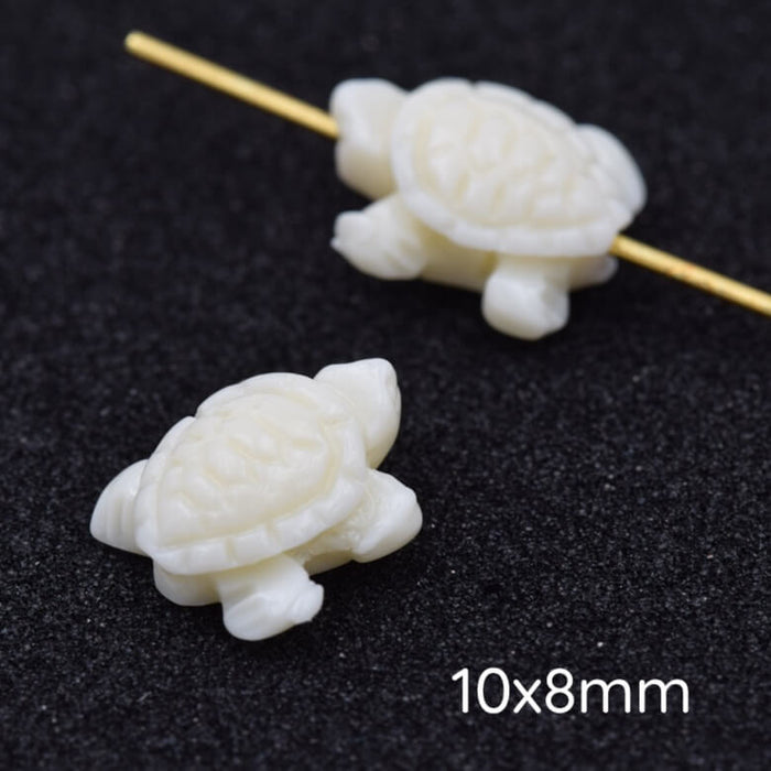 Elfenbeinfarbene Schildkrötenperle aus Kunstharz 10 x 8 mm – Loch: 1 mm (2)