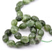 Ovale Trommelperlen dunkelgrüne Jade – 10 x 11–14 mm – Loch: 0.8 mm (1 Strang – 37 cm)