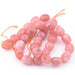 Ovale Trommelperlen rosa Jade – 10 x 12–14 mm – Loch: 0.8 mm (1 Strang – 37 cm)