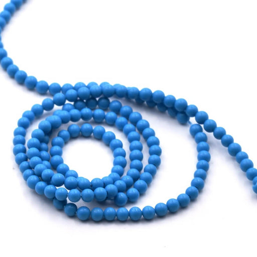 Synthetische türkisfarbene runde Perle 2–2,5 cm – Loch 0,8 mm (1 Strang – 39 cm)
