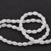Weiße Jade-Reis-Ovalperle 6 x 4 mm – Loch: 0.8 mm (1 Strang – 39 cm)