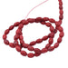 Ovale Reiskugel – rot getönter Howlith 6 x 4 mm (1 Strang – 39 cm)