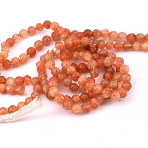 Kaufen Sie Perlen in Deutschland Runde Perle Sonnenstein 4 mm – Loch 0,6 mm (1 Strang – 33 cm)