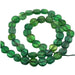 Grüner Onyx flach rund Perle 7-10mm - Loch: 0.5mm (1 Strang - 34cm)