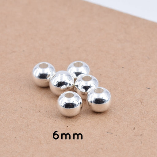 Kaufen Sie Perlen in Deutschland Runde Perlen Edelstahl Silber - 6x5 mm - Loch: 2 mm (10)