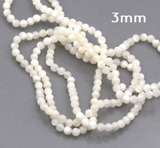 Kaufen Sie Perlen in Deutschland Naturweiße runde Muschelperle 3 mm Loch: 0.6 mm - Strang 39 cm (1 Strang)