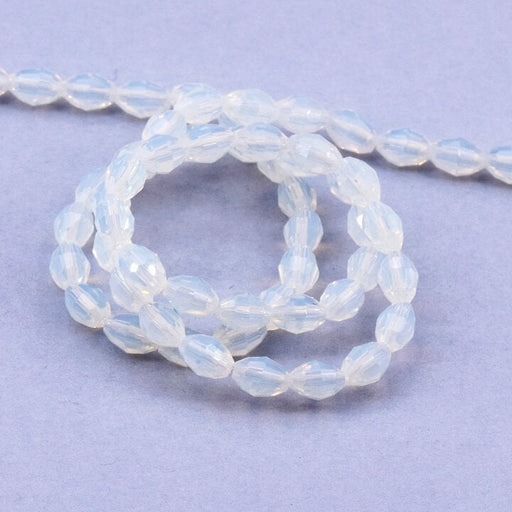 Kaufen Sie Perlen in Deutschland Ovale Glasperle facettiert Opalite - 6x4mm - Loch: 0.8mm (1 Strang-40cm)