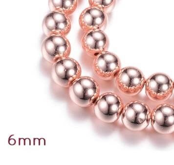 Kaufen Sie Perlen in Deutschland Rekonstituierte Hämatitperlen, ROSEgoldet, 6mm - 1 strang - 64 Perlen (1 strang)